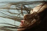 woman with hair blowing in the wind