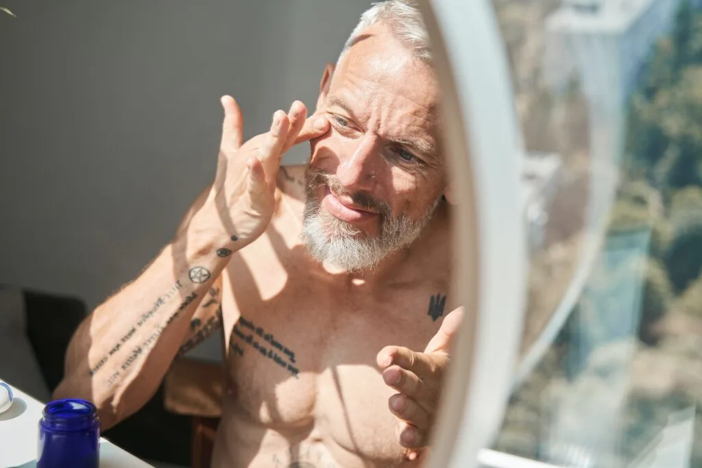 older man putting on face cream, can you get a facial before Botox